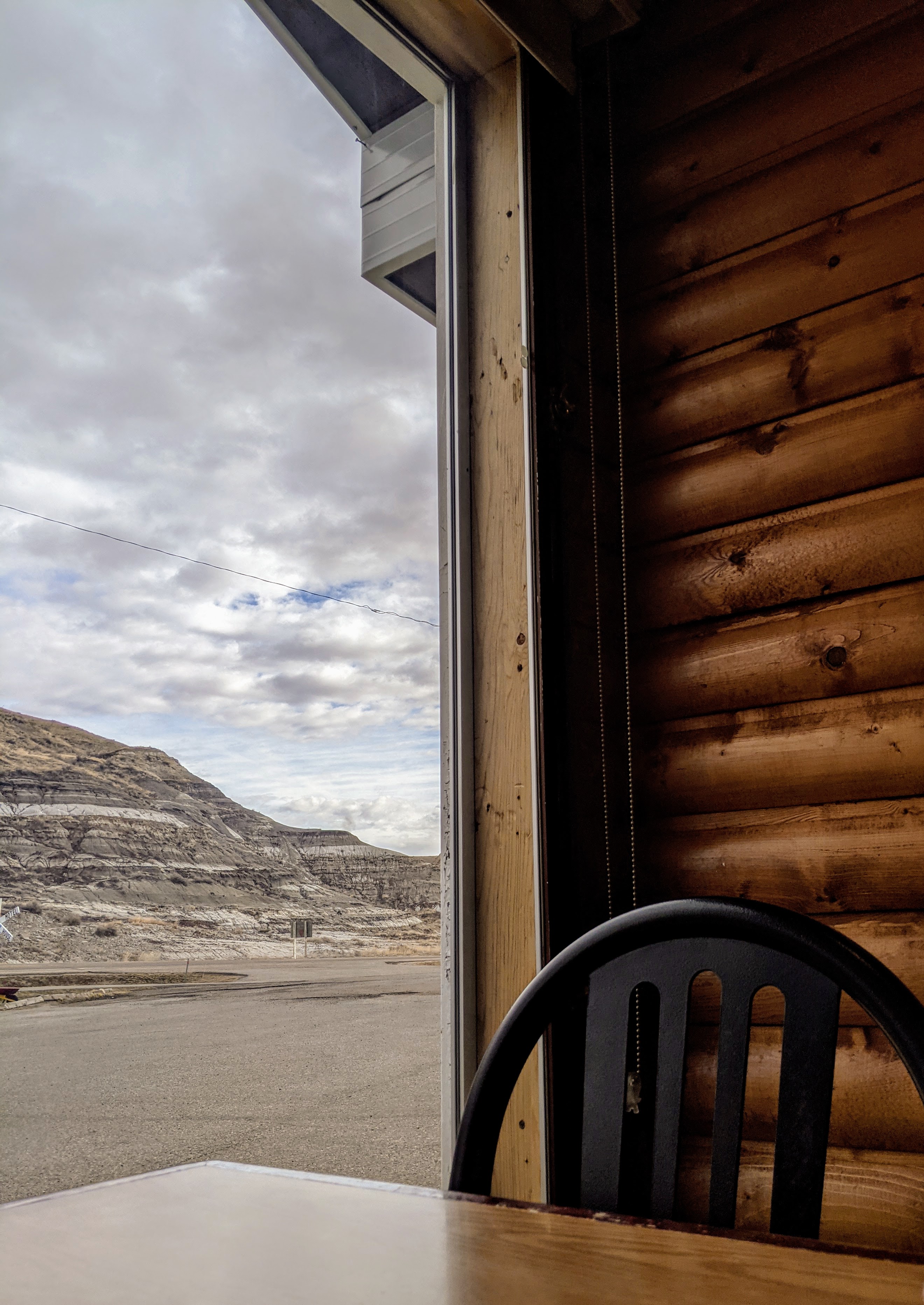 view from a window looking at the badlands landscape