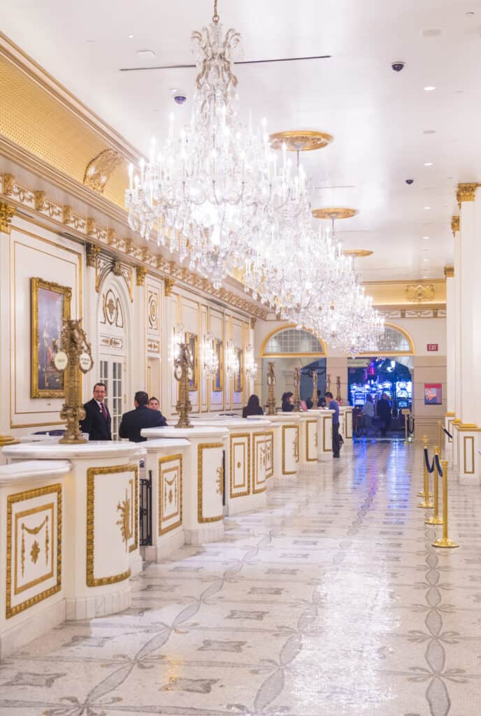 hotel lobby decorated in white and gold
